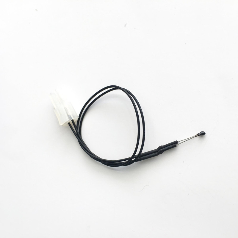 Focusens epoxy bead NTC thermistor with fine bare leads spliced under black heat-shrink to a two-wire black cable and a white two-pin connector